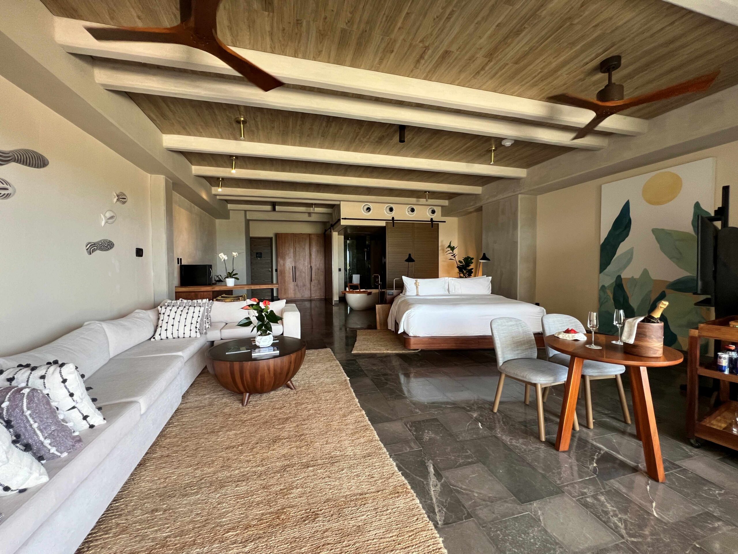 All-inclusive resort room showing the bed, and bathroom layout.